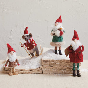 The CREATIVE COOP FELT MOUSE SKIING ORNAMENT features a handmade mouse in a red sweater and Santa hat, holding wooden ski poles and standing on skis—a charming holiday décor accent.