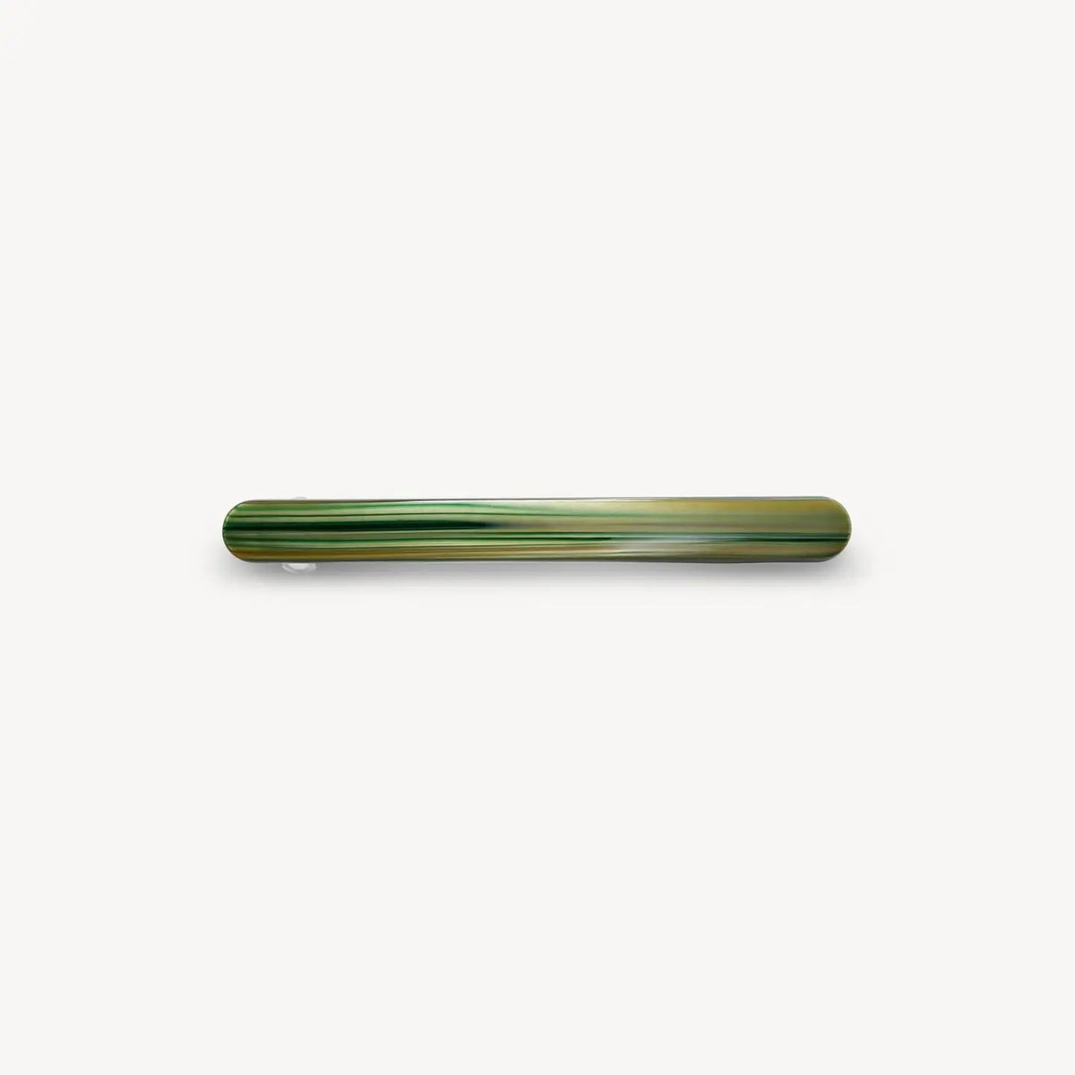 The MACHETE Slim Paris Barrette in Meadow, a long, slender green hair accessory with light and dark streaks, made from Italian acetate by MACHETE, is centered on a plain white background.