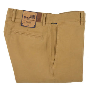 Close-up of PENNBILT - THE PLAINSMAN PANT IN DARK KHAKI, featuring tan Pima cotton fabric with a partially unzipped brass zipper and an open button. A blue “PENNBILT” label is sewn near the waistband.