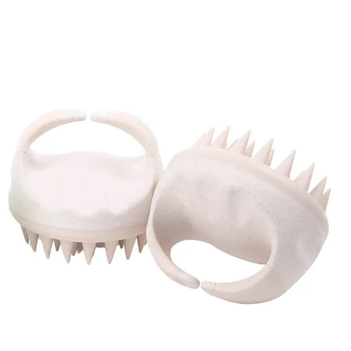 Two white SCALP MASSAGERS from GIFTEN MARKET feature comfortable, curved handles and evenly spaced rubber bristles. Designed for shower use, these scalp massagers effectively scrub and massage the scalp for healthier hair. One is displayed facing up to showcase the bristles, while the other is shown lying turned over.