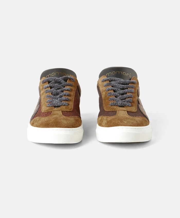 The MOMONI - VENEZIA SNEAKER by MOMONI features black and gray leather uppers, a white box sole, and lace-up front. Displayed from the front against a plain light gray background.
