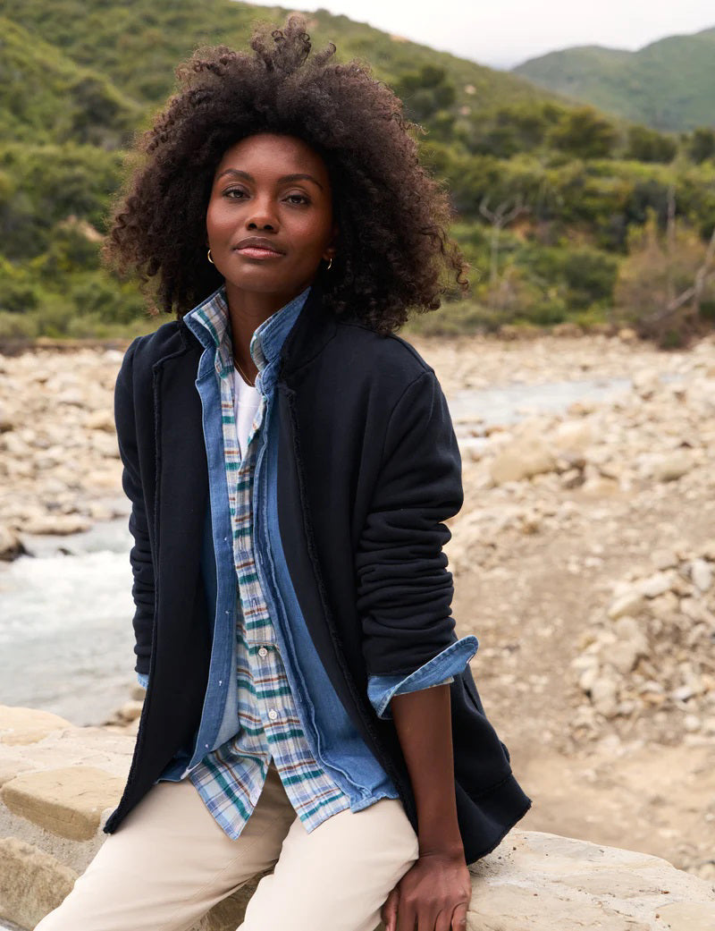 The FRANK AND EILEEN - DUBLIN KNIT BLAZER from FRANK &amp; EILEEN is showcased against a plain white background, featuring notched lapels and two front pockets. The sleeves are slightly rolled, and the fabric reveals a soft, textured appearance with a tailored fit.