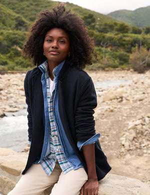 The FRANK AND EILEEN - DUBLIN KNIT BLAZER from FRANK & EILEEN is showcased against a plain white background, featuring notched lapels and two front pockets. The sleeves are slightly rolled, and the fabric reveals a soft, textured appearance with a tailored fit.