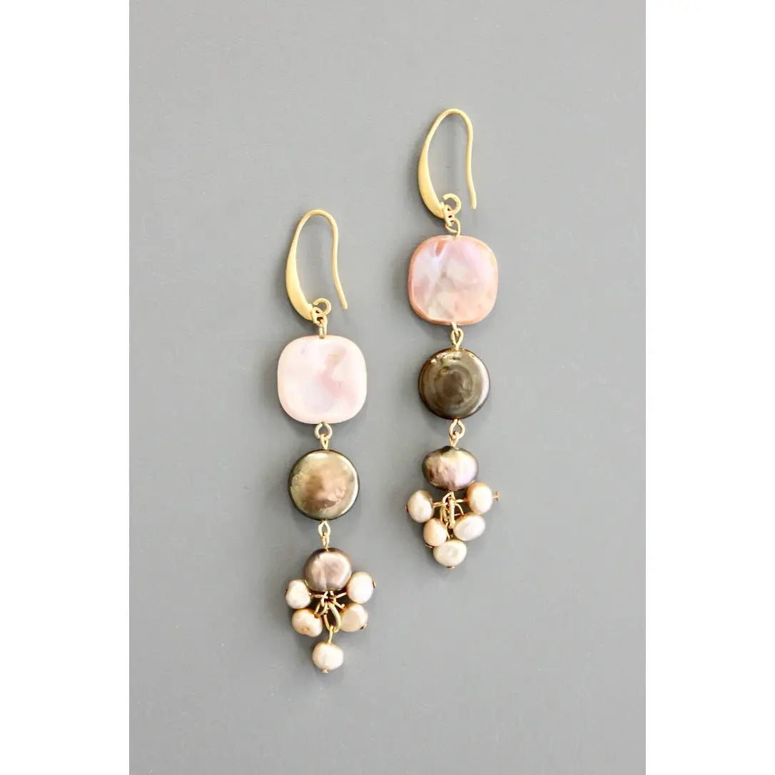 DAVID AUBREY Mother of Pearl and Fresh Water Pearl Earrings feature gold hooks, square pink and brown beads, round beads, and pearl clusters at the bottom, displayed on a gray background.