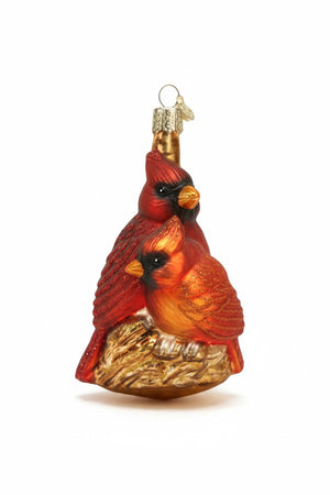 Two red cardinal birds perched together on a branch as an Old World Christmas PAIR OF CARDINALS ORNAMENT.