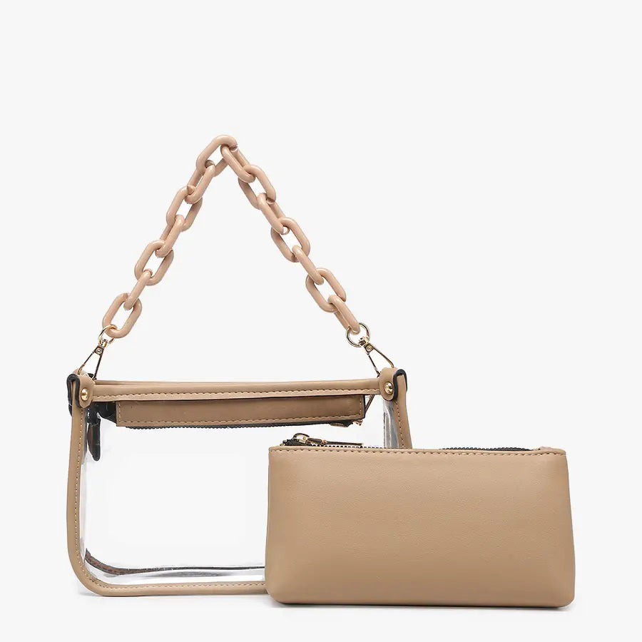 Introducing the CLEAR CROSSBODY BAG by JEN &amp; CO: A stylish handbag crafted from vegan leather, showcasing a layered beige design with an open top and a visible zipper pocket. This bag is elegantly framed by a transparent outer layer and is complemented by a chunky beige chain strap for additional style and versatility.