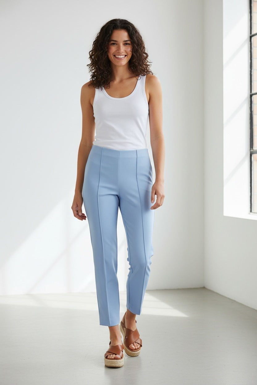 The MAC - ANNA PULL ON PANT by MAC features high-waisted, straight-leg pink trousers made from easy-care fabric, with front creases and small hem slits, shown on a white background.