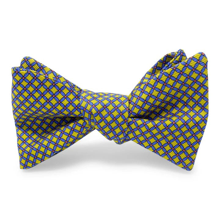 The BIRD DOG BAY PETER-BLAIR Cushions Silk Bow Tie in yellow features a blue checkered pattern, handmade design, adjustable neck sizing for a perfect fit, and is displayed against a white background.