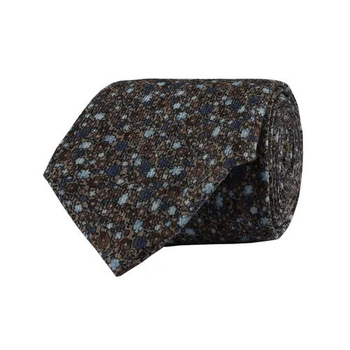 A rolled-up AMANDA CHRISTENSEN Floral Wool Tie in Beige Melange is displayed on a white background—an elegant choice for men’s accessories and the perfect finishing touch for business wear.