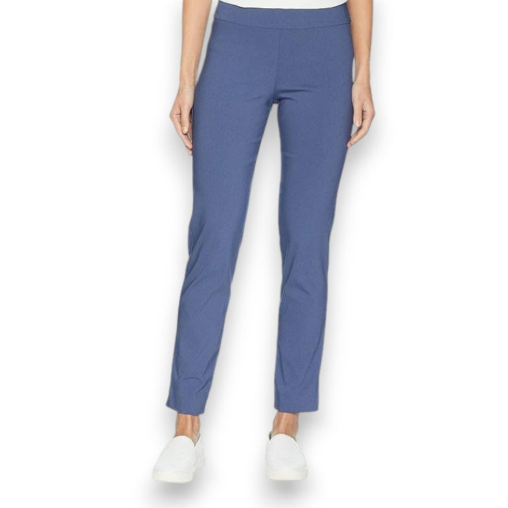 A person is wearing KRAZY LARRY, INC&#39;s PULL ON ANKLE PANT in a slim fit beige straight-leg style and black high-heeled shoes against a white background. The outfit is completed with a sleeveless black top that reveals part of the arms and torso.