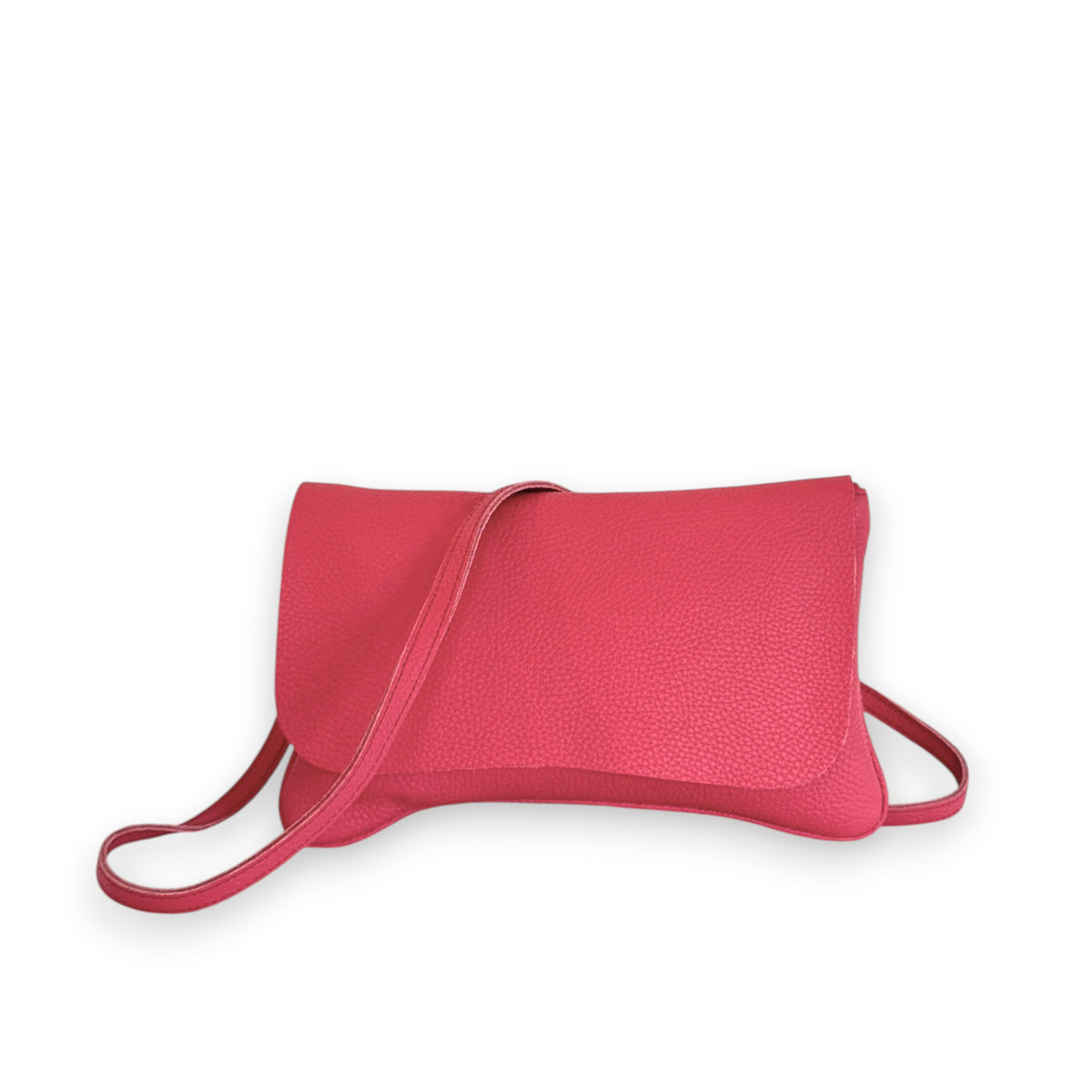 The OLIVEVE Cecilia Crossbody, made from punch Italian buffalo cowhide, is a pink leather clutch purse with a flap closure and long crossbody strap, elegantly displayed against a white backdrop.