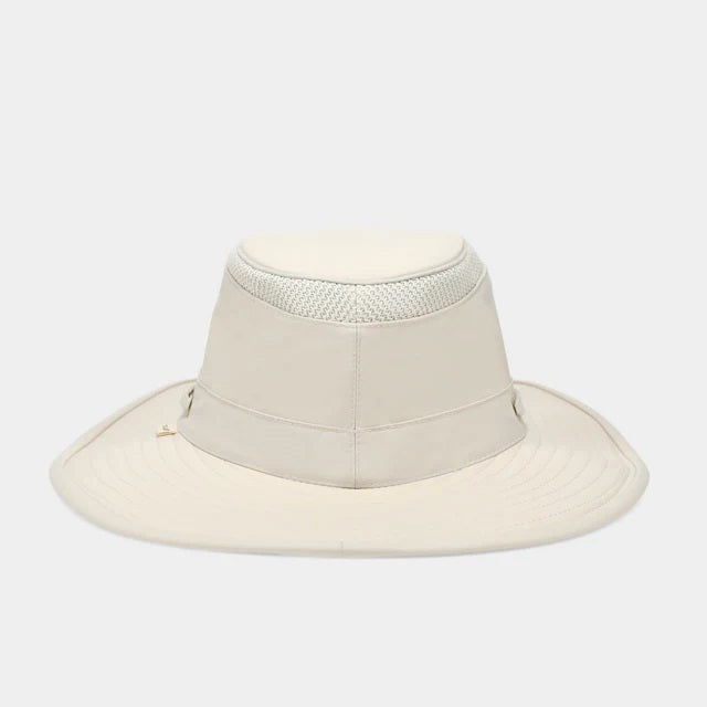 The TILLEY AIRFLO BROAD BRIM HAT LTM6 in Light Stone is a recycled nylon sun hat with UPF 50+ protection, wide brim, mesh ventilation near the crown, and a small band tag. Shown on a plain white background.