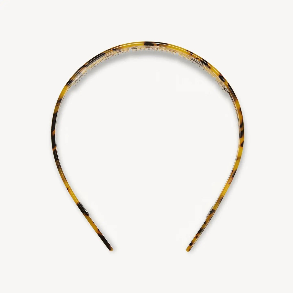 The MACHETE Ultralight Thin Headband in Tortoise features glossy Italian acetate in brown and yellow tones; it's lightweight, curved, fits all hair types, and is shown on a plain white background.