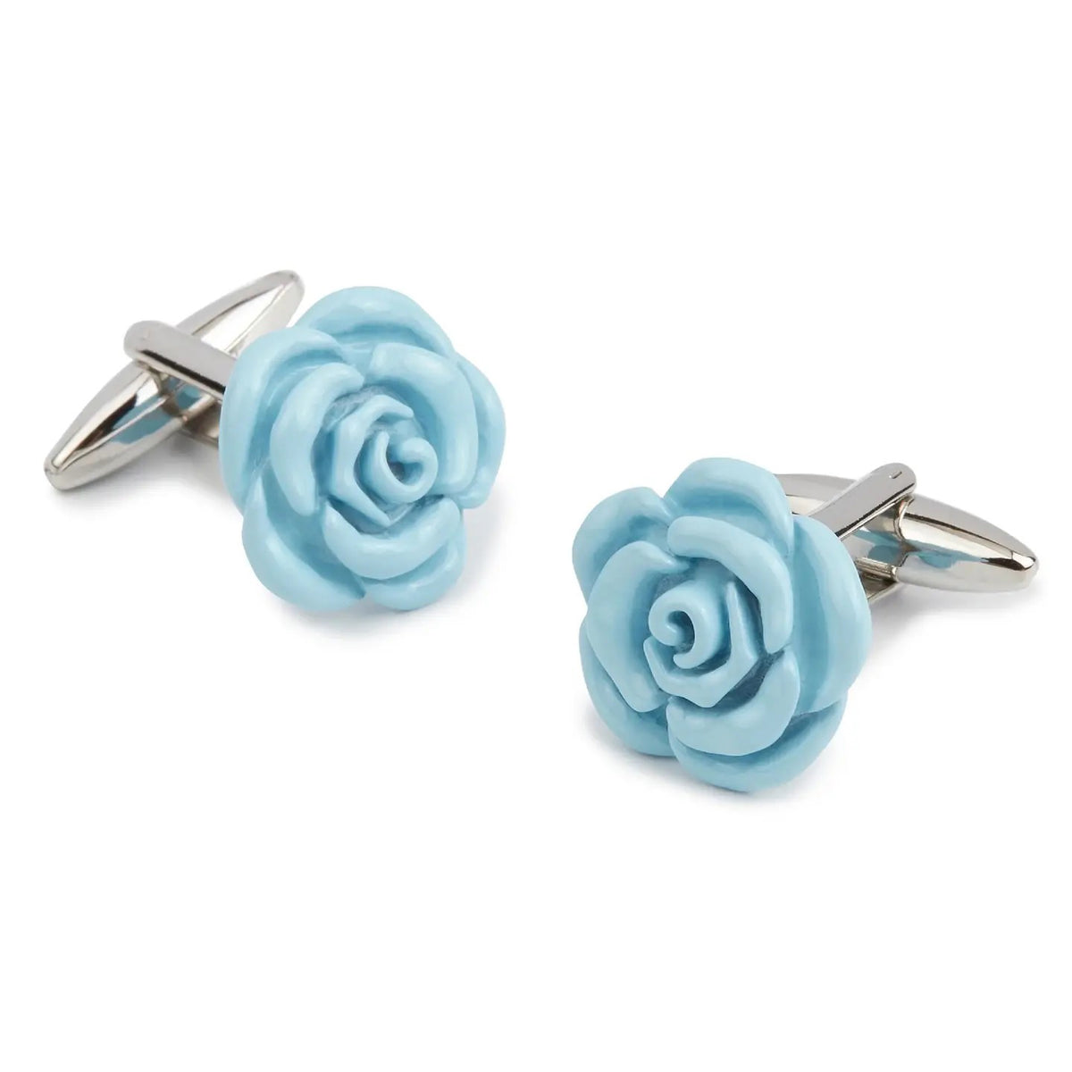 STOLEN RICHES - BABY BLUE ROSE CUFFLINKS by STOLEN RICHES feature detailed light blue rose-shaped tops—stylish men's accessories and a refined gift for him, shown on a white background.