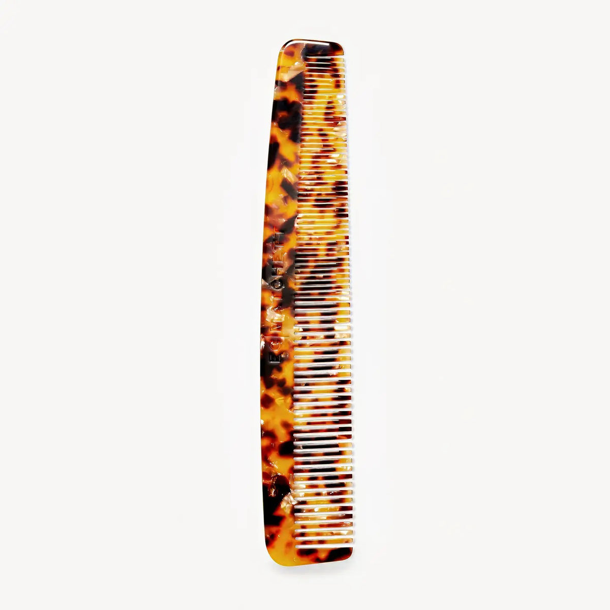 The MACHETE - BARBER COMB IN MOERU GOJIRA by MACHETE is an Italian acetate comb with a brown and amber tortoiseshell pattern, featuring both fine and wide teeth, shown on a plain white background.