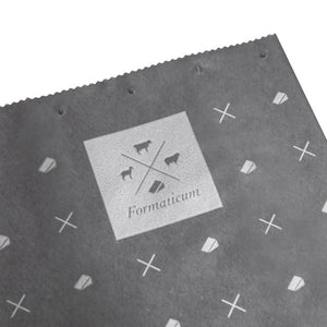 A box of FORMATICUM - REUSABLE CHEESE STORAGE BAGS by FORMATICUM features a white and black design, “Reduce cheese waste” and “Keeps cheese fresher, longer” text, and contains 10 reusable bags.