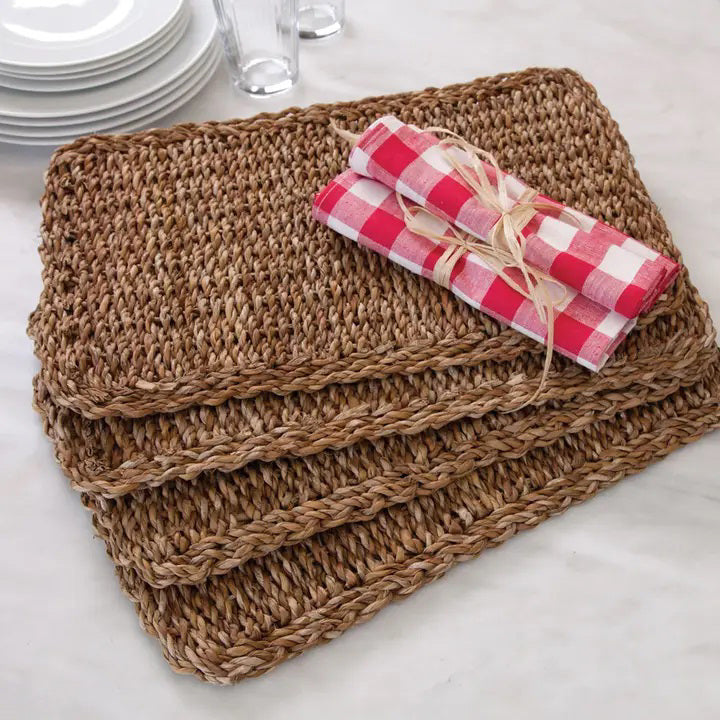 The NAPA HOME AND GARDEN - SEAGRASS RECTANGULAR PLACEMAT, made from natural fibers with a textured pattern, is shown on a white background. A perfect piece for home decor.