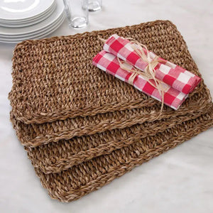 The NAPA HOME AND GARDEN - SEAGRASS RECTANGULAR PLACEMAT, made from natural fibers with a textured pattern, is shown on a white background. A perfect piece for home decor.