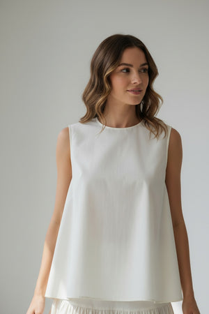 A close-up of the MEIMEIJ Sleeveless Cotton Top reveals dark cotton poplin fabric with textured, subtle horizontal lines and a slightly uneven surface in a deep, muted purple shade.