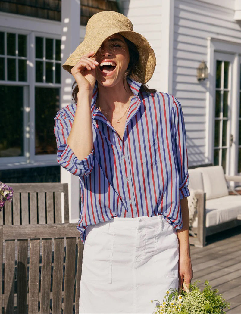 The FRANK &amp; EILEEN EILEEN Relaxed Button Up Shirt in Superluxe Cotton Stripe features a relaxed fit, long sleeves, red/white/blue vertical stripes, front pocket, rolled-up sleeves, and a curved hem.