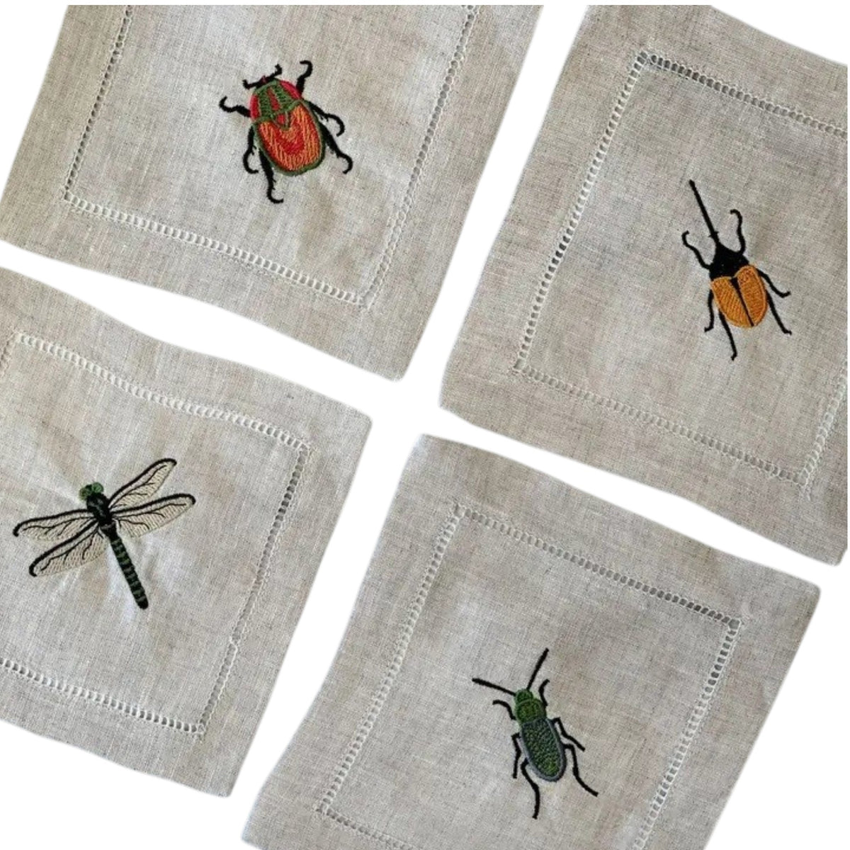 The EMBROIDERED INSECT COCKTAIL COASTER set by DOT AND ARMY includes four white reusable coasters, each edged in black and featuring a unique embroidered insect design—perfect for any gathering.