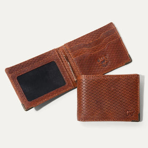 The WILL LEATHER GOODS Industrialist Billfold in Ginger Pindot is shown closed on a white background, featuring full-grain leather and a subtle embossed animal logo at the top right corner.