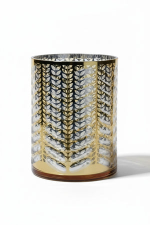 Three 7 in x 9.5 in ZODAX LASER ETCHED METALLIC HURRICANE 19.5″ cylindrical glass hurricane candle holders with laser-etched metallic leaf patterns.
