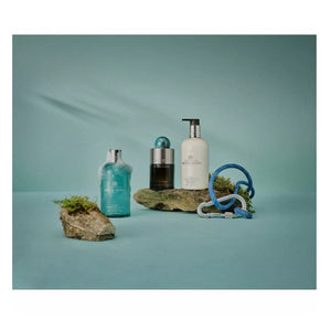 A 300ml blue bottle of MOLTON BROWN COASTAL CYPRESS BODY WASH features a silver cap and white label, shown against a white background.