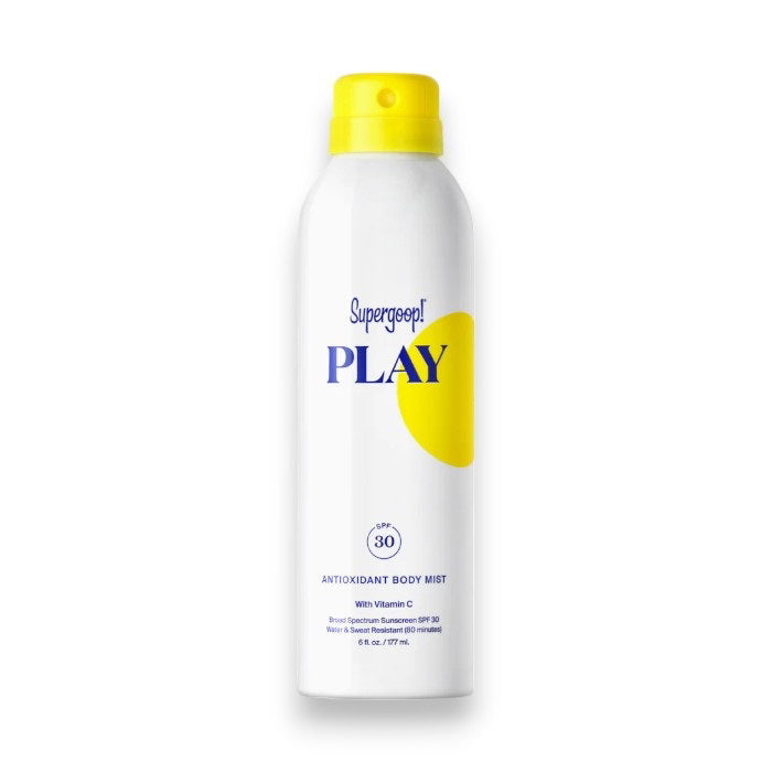 A white cylindrical spray bottle of SUPERGOOP - PLAY BODY MIST SPF30. The sunscreen body spray has a yellow cap and features text in blue and yellow. It contains 177ml (6 fl. oz.) and includes Vitamin C for glowing skin benefits, along with being water-resistant.