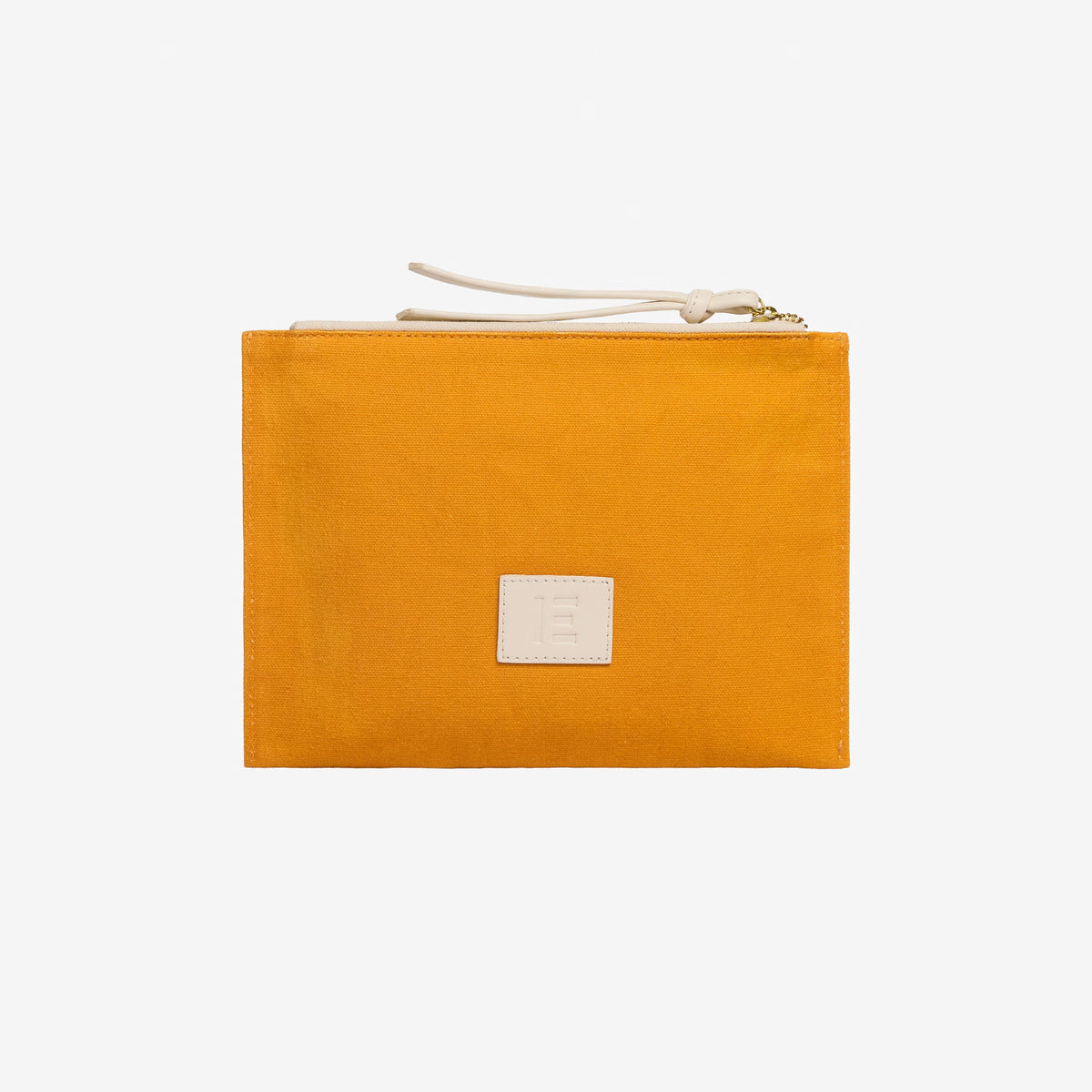 The INOUI EDITIONS - CAT EMBROIDERED POUCH by INOUI is a rectangular mustard yellow cotton pouch with a beige zipper pull and a small beige patch featuring an embossed “E” on the front, shown against a plain white background.
