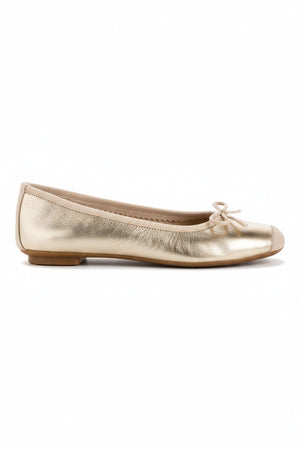 A top view of the REQINS Harmony Bellerina Flat in metallic platinum, featuring a small toe bow and crafted from metallic leather, displayed on a plain light background.