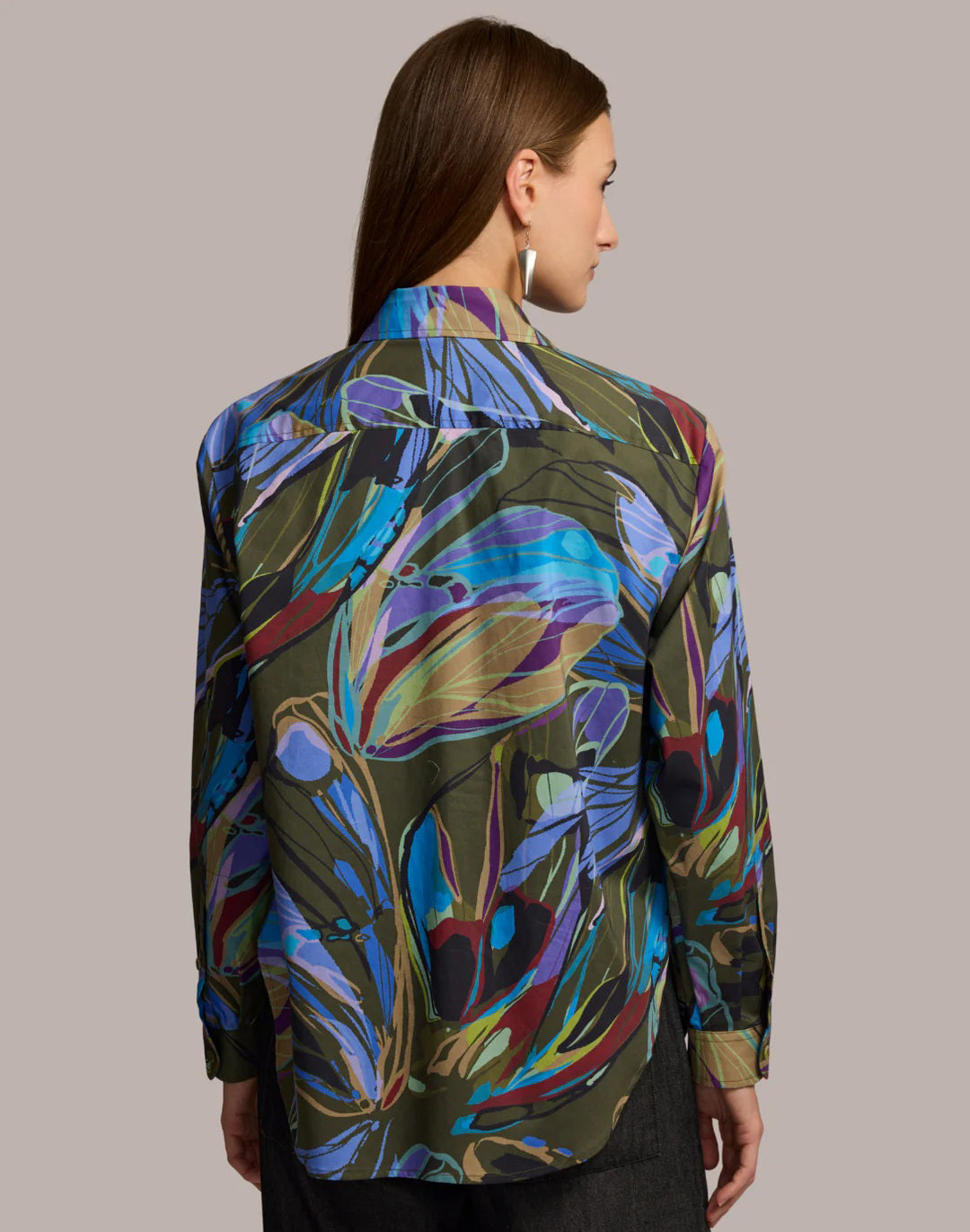 A woman with long brown hair wears the HINSON WU Halsey Long Sleeve Shirt in Abstract Print, made from a premium cotton blend, posing against a plain background with a neutral expression.