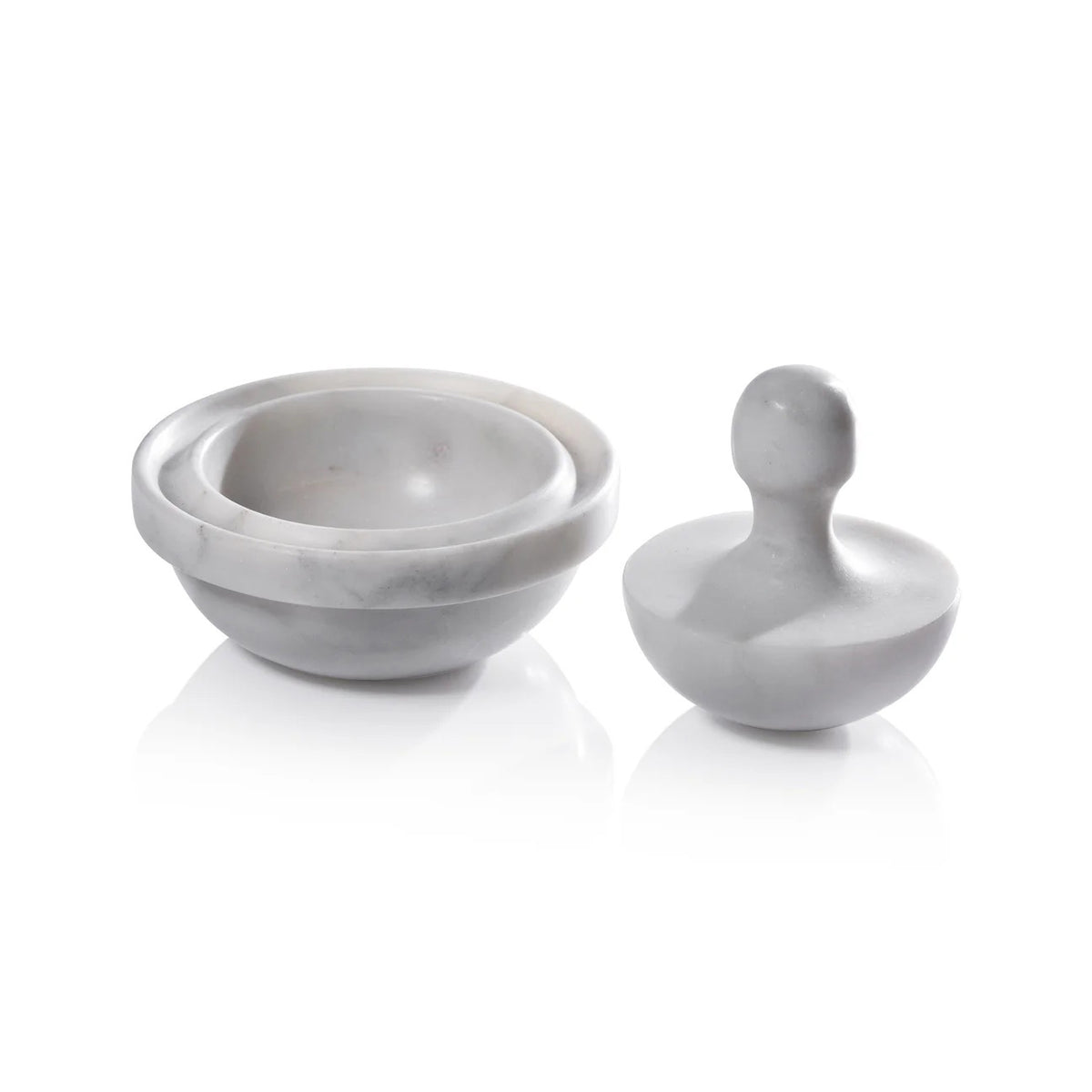 The ZODAX MARBLE SPICE GRINDER features a white marble mortar—a shallow, round bowl—and a dome-shaped pestle with a rounded handle, all set against a white background.