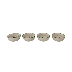 CREATIVE COOP's HAND-PAINTED STONEWARE BOWLS WITH BOTANICAL DESIGN, some holding green peppers or grains, are arranged on a light beige surface—each bowl highlights its unique handcrafted artistry.