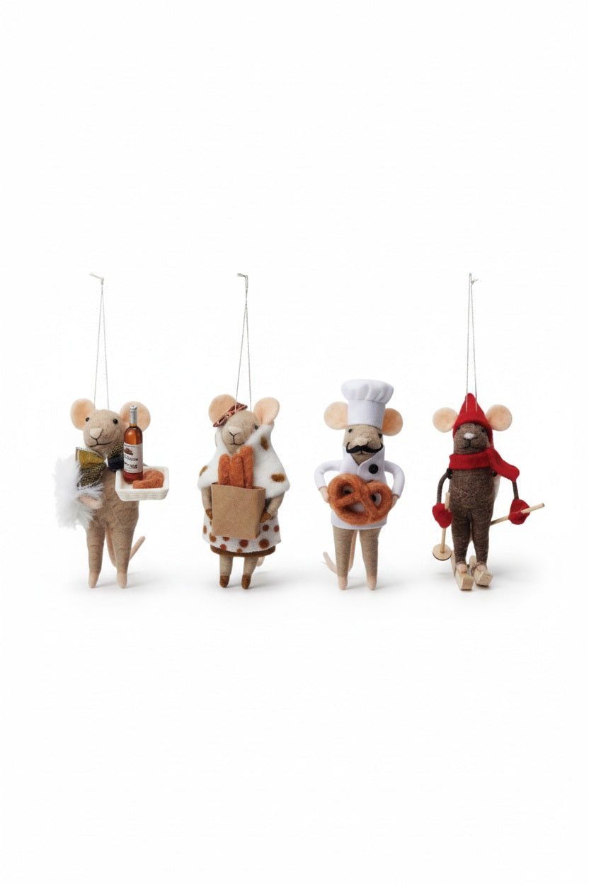 Four FELT MOUSE GOURMAND ORNAMENTs: one with a wine bottle and tray, one holding a bag of baguettes, one dressed as a chef holding a pretzel, and one wearing a hat and scarf with skis.