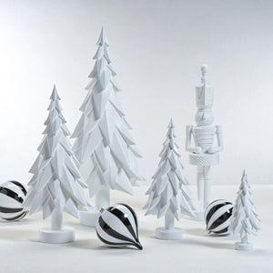 The ZODAX MATTE WHITE DECORATIVE TREE - LARGE features layered, geometric branches and a round base, making it the ideal minimalist accent for modern homes.