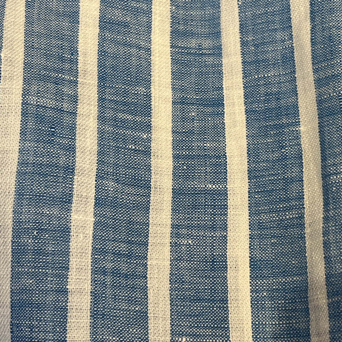 The FRANK &amp; EILEEN Finbar men's button-up shirt in turquoise with white stripes features washed linen, a back view, and long sleeves rolled up.