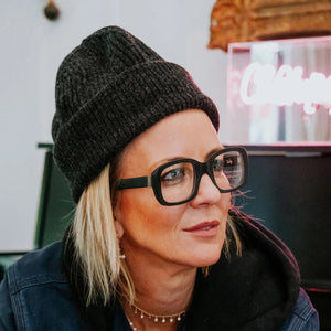 CADDIS - SHELBY PROGRESSIVE READERS by CADDIS are black, square, thick-rimmed eyeglasses with oversized frames and clear, scratch-resistant lenses. Shown front-facing on white; "Shelby" printed in white inside the left arm.