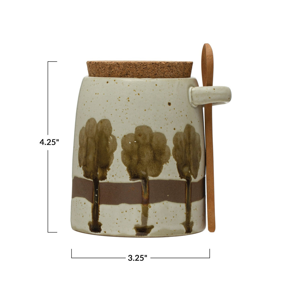 The CREATIVE COOP Hand-Painted Stoneware Jar features a green tree design, cork lid, and wood spoon. Perfect for kitchen storage. Measures 4.25" tall x 3.25" wide.