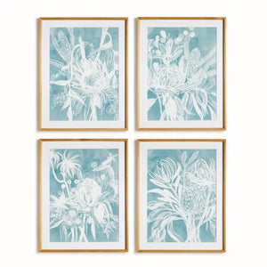 A framed protea abstract print in soft blue by NAPA HOME AND GARDEN, featuring a white floral illustration on a blue background. This botanical wall art is presented in a light wood frame for a fresh, contemporary look—perfect for modern home décor.