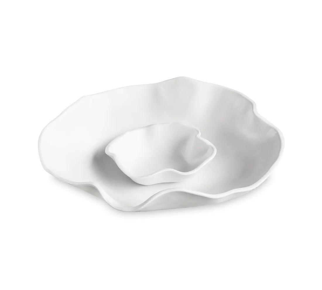 The BEATRIZ BALL - VIDA NUBE BOWL WITH DIP features two white, organically-shaped ceramic platters with wavy edges, nested together like petals or waves. They rest elegantly against a plain white backdrop, reminiscent of the sophisticated VIDA Nube collection by Beatriz Ball.