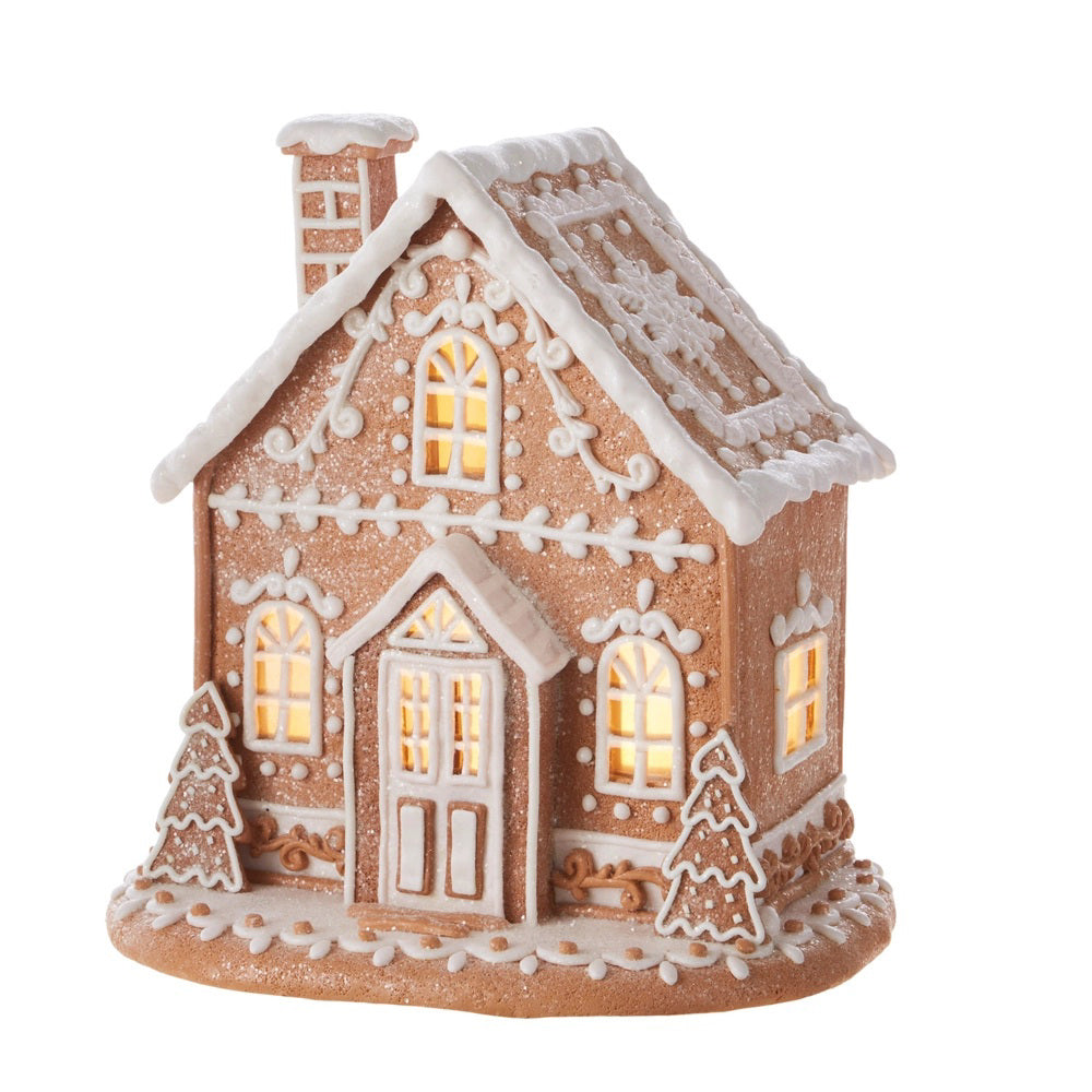 The RAZ IMPORTS LIGHTED GINGERBREAD HOUSE 12" features clay dough with white icing details, frosted roof, lit windows, and a 6-hour timer. It rests on a snowy cookie base with two icing trees, perfect for festive décor. Battery operated.