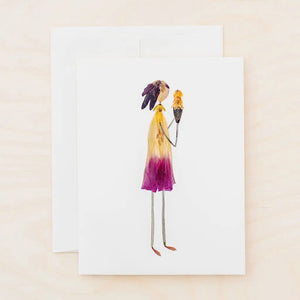 The PETAL PEOPLE PRESS - THREE SCOOPS card by PETAL PEOPLE PRESS showcases a woman holding an ice cream cone made from real pressed flower petals and leaves, displayed on a white surface with green leaves, pruning shears, and a paperclip nearby.