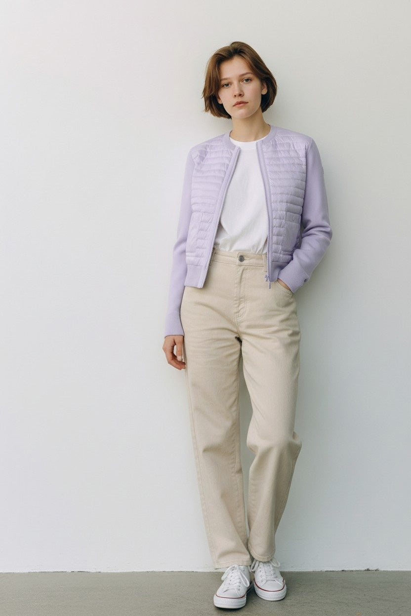 The SAVE THE DUCK - BRIONY LIGHTWEIGHT PUFFER is a light purple, collarless cropped jacket perfect for summer layering, featuring a quilted front, smooth sleeves and sides, front zipper closure, and two front flap pockets.