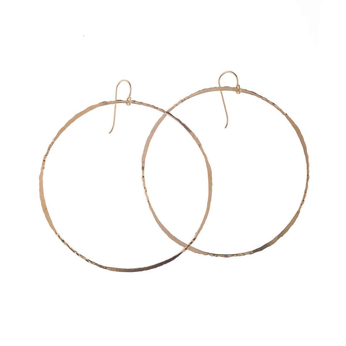 KENDA KIST - BETSY HOOPS: Large, hand-forged 14k gold filled hoops by KENDA KIST featuring simple hook clasps, shown on a plain white background.