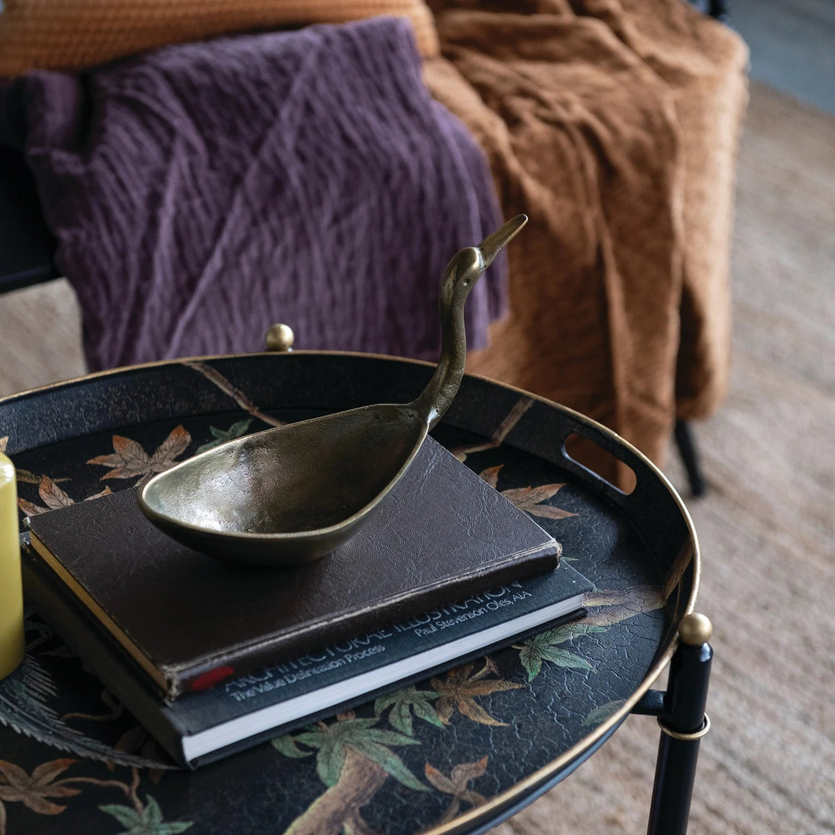 The CREATIVE COOP BIRD SHAPED BOWL IN ANTIQUE BRASS FINISH features a cast aluminum body with an elongated neck and beak, resembling a crane or heron for a stunning decorative accent.