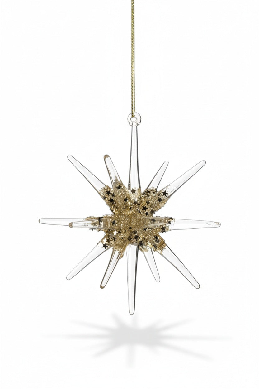 Two 4.75-inch GLASS 3D SNOWFLAKE ORNAMENT SMALL star-shaped glass ornaments with gold glitter accents hanging from a pine branch.