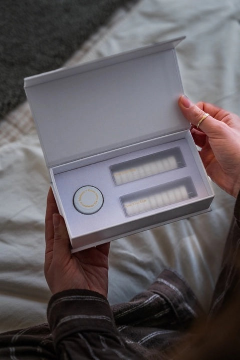 A set of MADISON GREEN - REST YOUR EYES ON THE BED relaxing eye masks and a small jar, all packaged in minimalist white with light brown text, displayed against a plain white background.