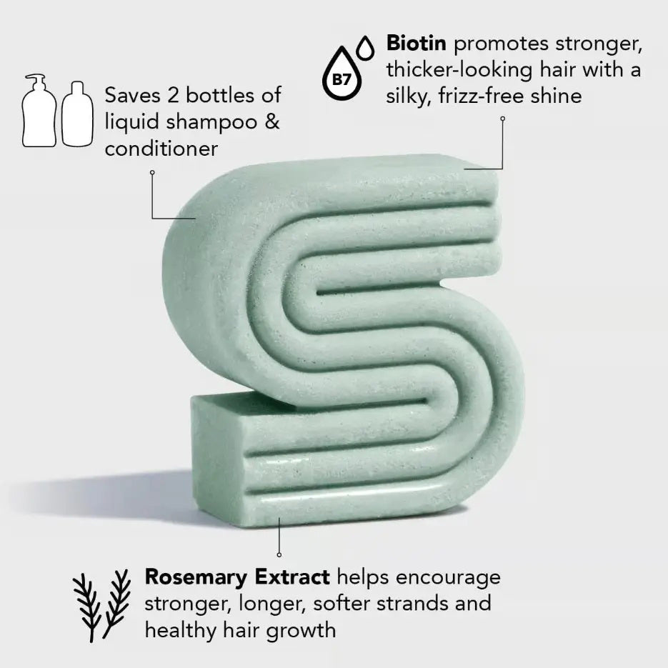 A green KITSCH box labeled “Rosemary and Biotin Volumizing Solid Shampoo Bar” stands behind a matching bar for hair growth; the 3.2 oz (91g) vegan formula is color safe and pH balanced.
