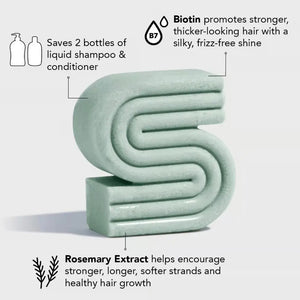 A green KITSCH box labeled “Rosemary and Biotin Volumizing Solid Shampoo Bar” stands behind a matching bar for hair growth; the 3.2 oz (91g) vegan formula is color safe and pH balanced.